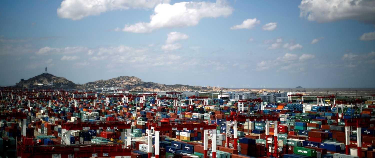 FILE PHOTO: A container area is seen at the Yangshan Deep Water Port, part of the newly announced Shanghai Free Trade Zone, south of Shanghai September 26, 2013. REUTERS/Carlos Barria/File Photo - RTS11VY3