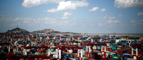 FILE PHOTO: A container area is seen at the Yangshan Deep Water Port, part of the newly announced Shanghai Free Trade Zone, south of Shanghai September 26, 2013. REUTERS/Carlos Barria/File Photo - RTS11VY3