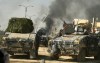 Smoke rising from clashes is seen through a military vehicle during a battle with Islamic State militants in Mosul, Iraq, March 6, 2017.