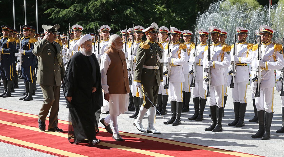 Iran's President Hassan Rouhani (L) and India's Prime Minister Narendra Modi review the honor guard during an official welcoming ceremony in Tehran, Iran May 23, 2016. President.ir/Handout via REUTERS FOR EDITORIAL USE ONLY. NO RESALES. NO ARCHIVES. ATTENTION EDITORS - THIS PICTURE WAS PROVIDED BY A THIRD PARTY. - RTSFHK9
