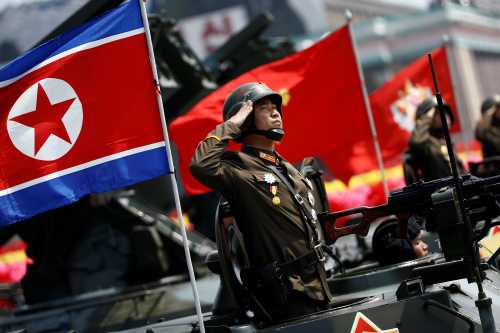 A soldier salutes from atop an armoured vehicle as it drives past the stand with North Korean leader Kim Jong Un during a military parade marking the 105th birth anniversary of country's founding father Kim Il Sung, in Pyongyang April 15, 2017. REUTERS/Damir Sagolj - RTS12E3O