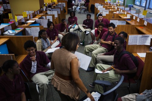 Newark Prep Charter School students listen to academic coach, Robbie Garland, while taking part in an advisory session at the school in Newark, New Jersey