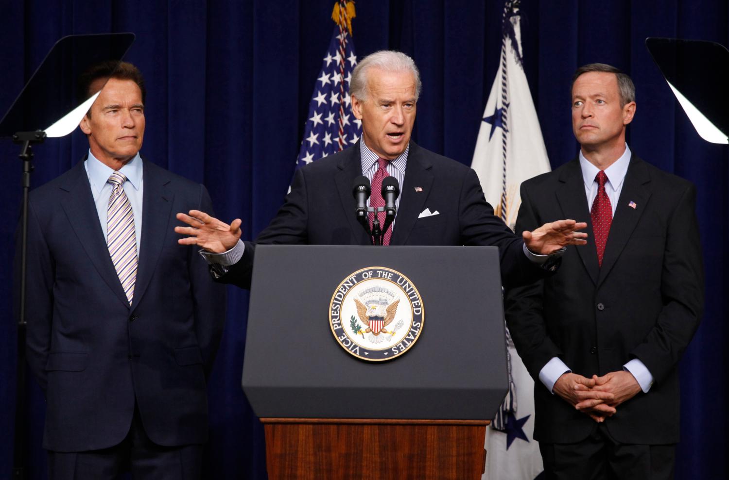 U.S. Vice President Joe Biden discusses the American Recovery and Reinvestment Act to an audience alongside California Governor Arnold Schwarzenegger (L) and Maryland Governor Martin O'Malley in the Eisenhower Executive Office building in Washington