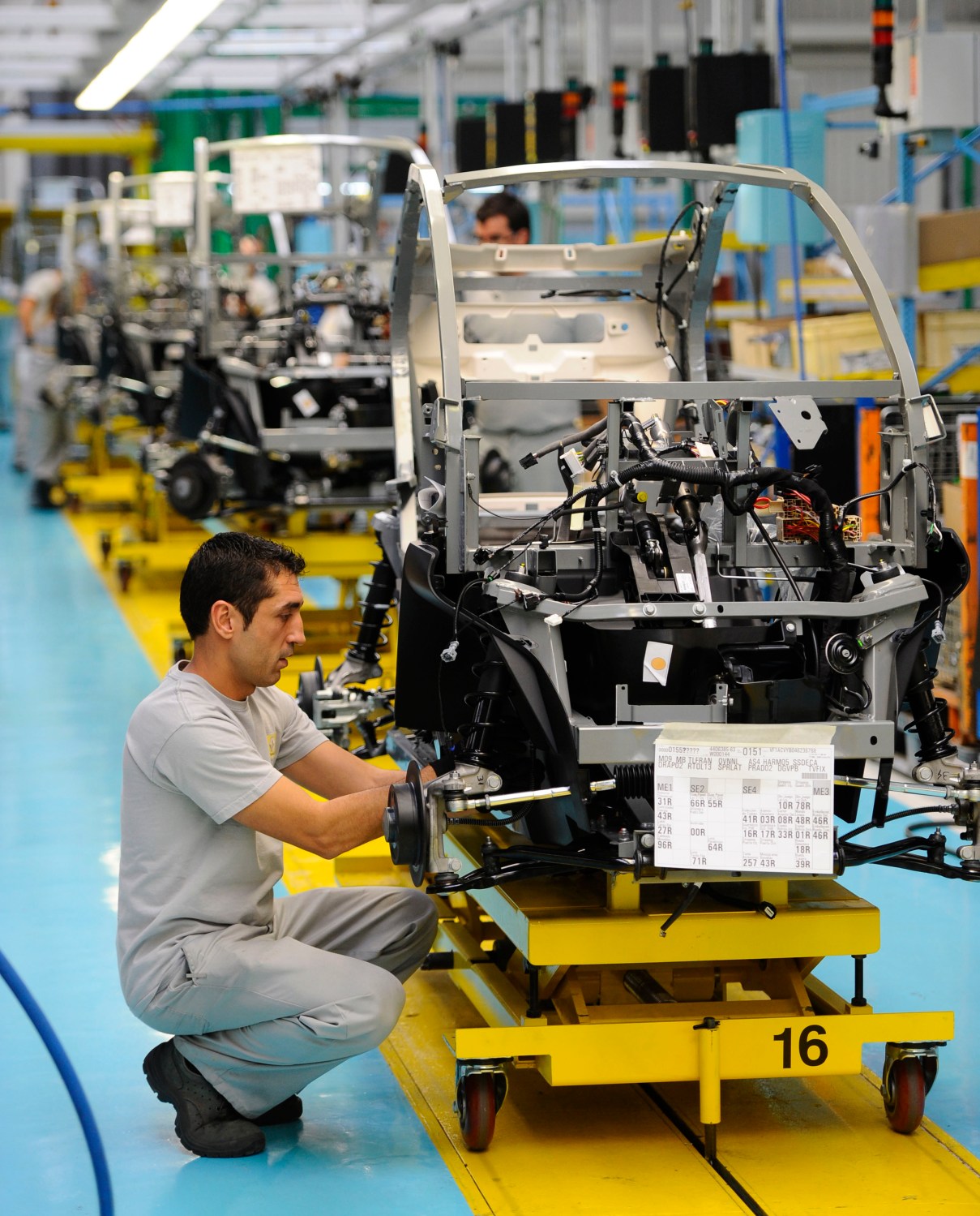 An employee works in the assembly of the new Renault Twizy Zero Emission electric car in Valladolid