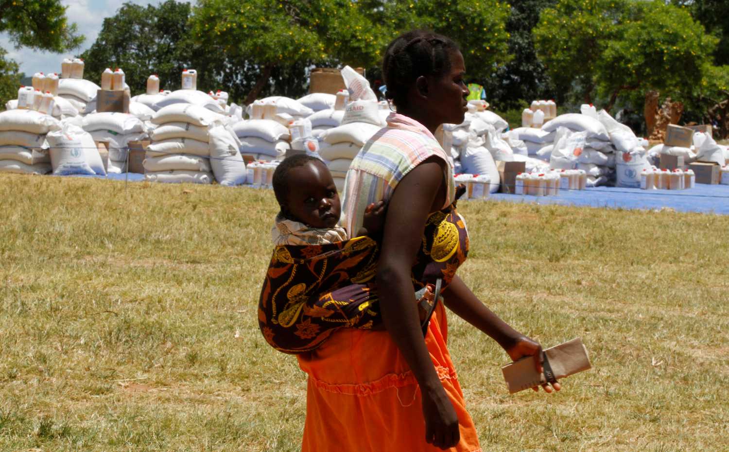 A Zimbabwean mother arrives to collect her monthly rations of food aid from Rutaura Primary School in Rushinga district of Mt Darwin about 254km north of Harare