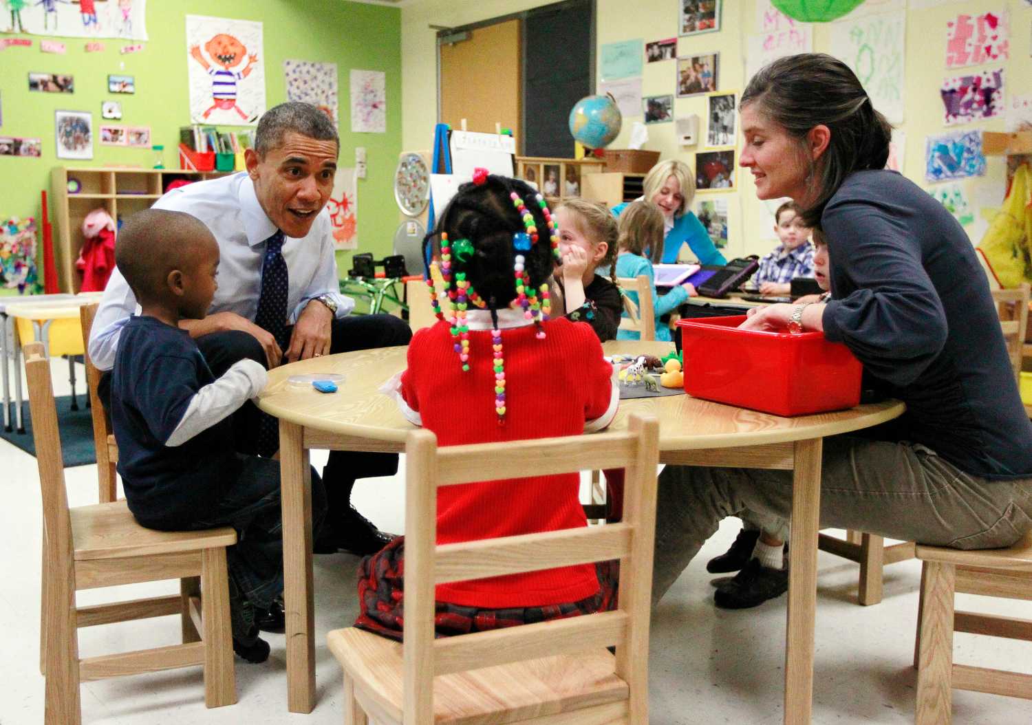 U.S. President Barack Obama meets with children in a pre-kindergarten classroom at College Heights early childhood learning center in Decatur