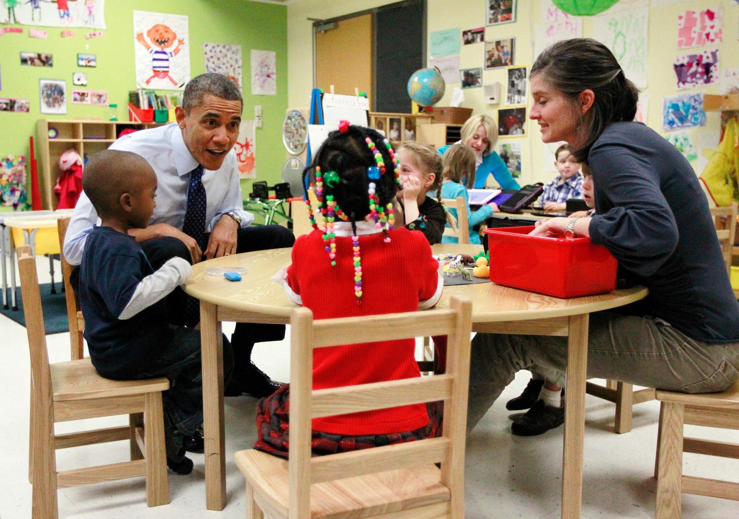U.S. President Barack Obama meets with children in a pre-kindergarten classroom at College Heights early childhood learning center in Decatur
