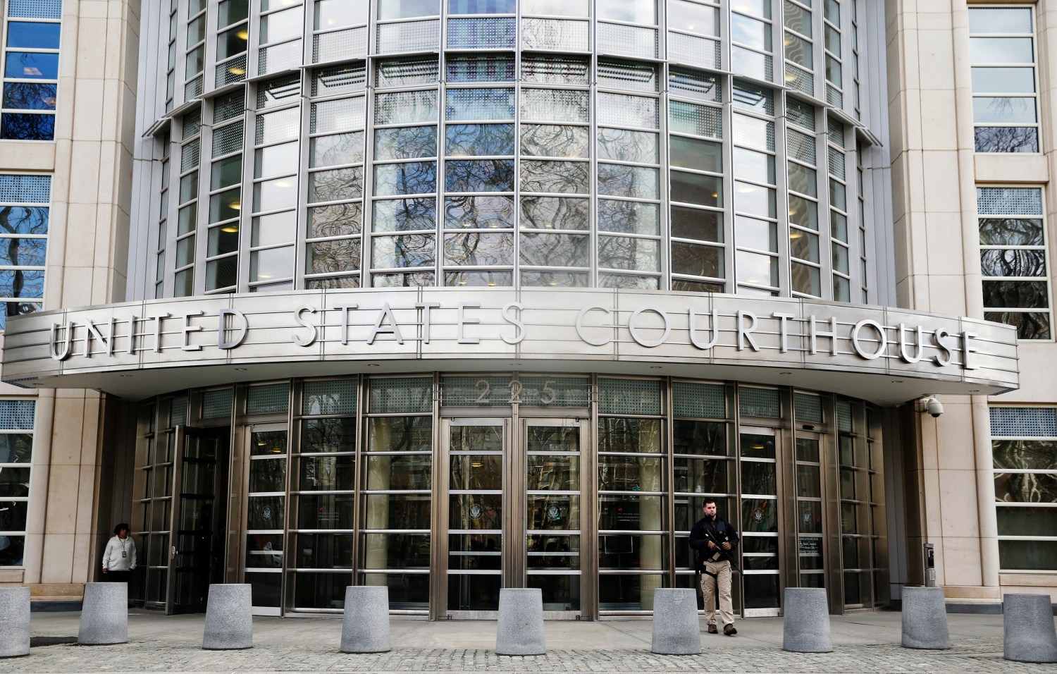 An armed U.S. Marshall stands outside federal court in Brooklyn before the court appearance of Tairod Nathan Webster Pugh, of Neptune, New Jersey, in the borough of Brooklyn in New York