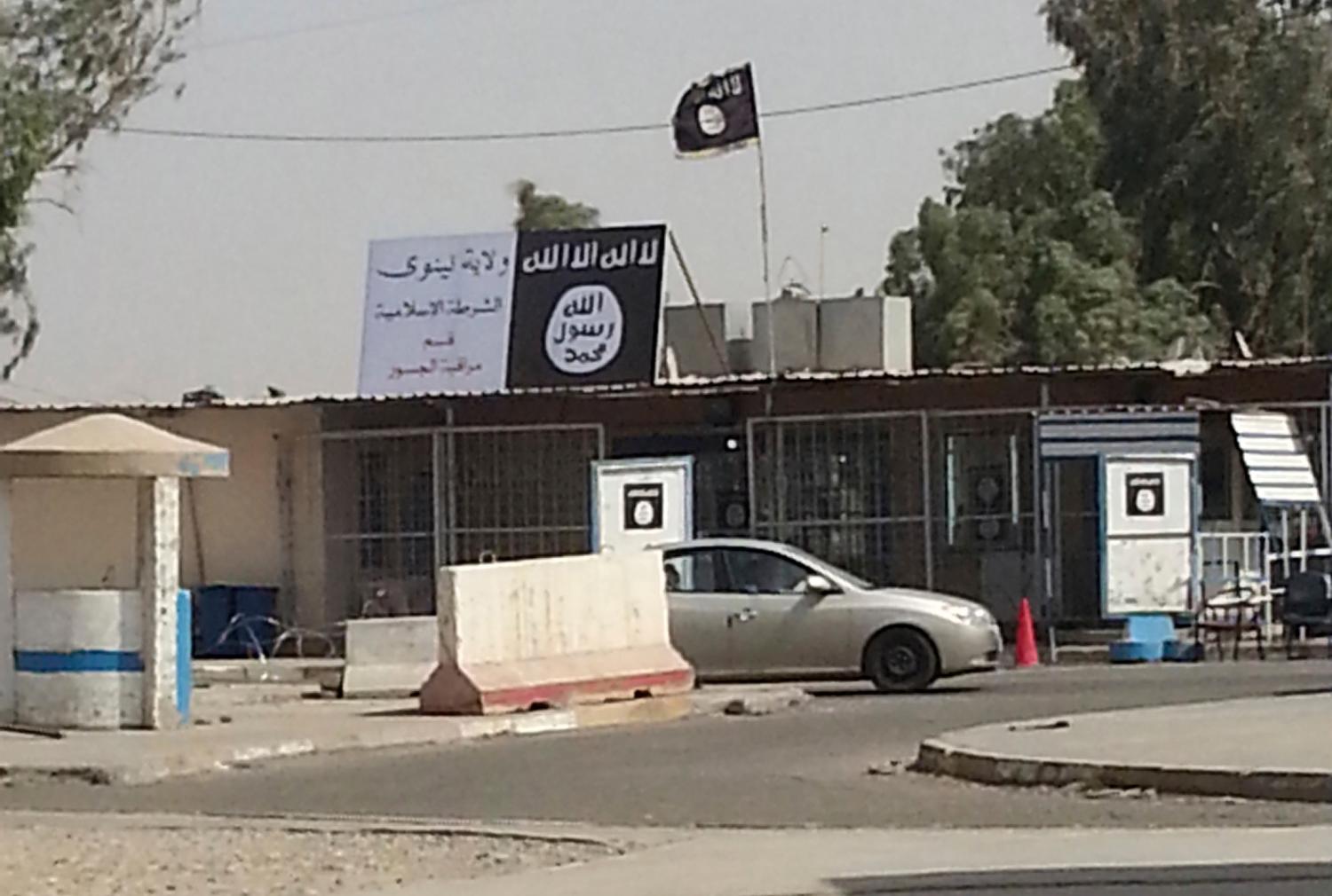 A sign by the Islamic State is seen in the city of Mosul
