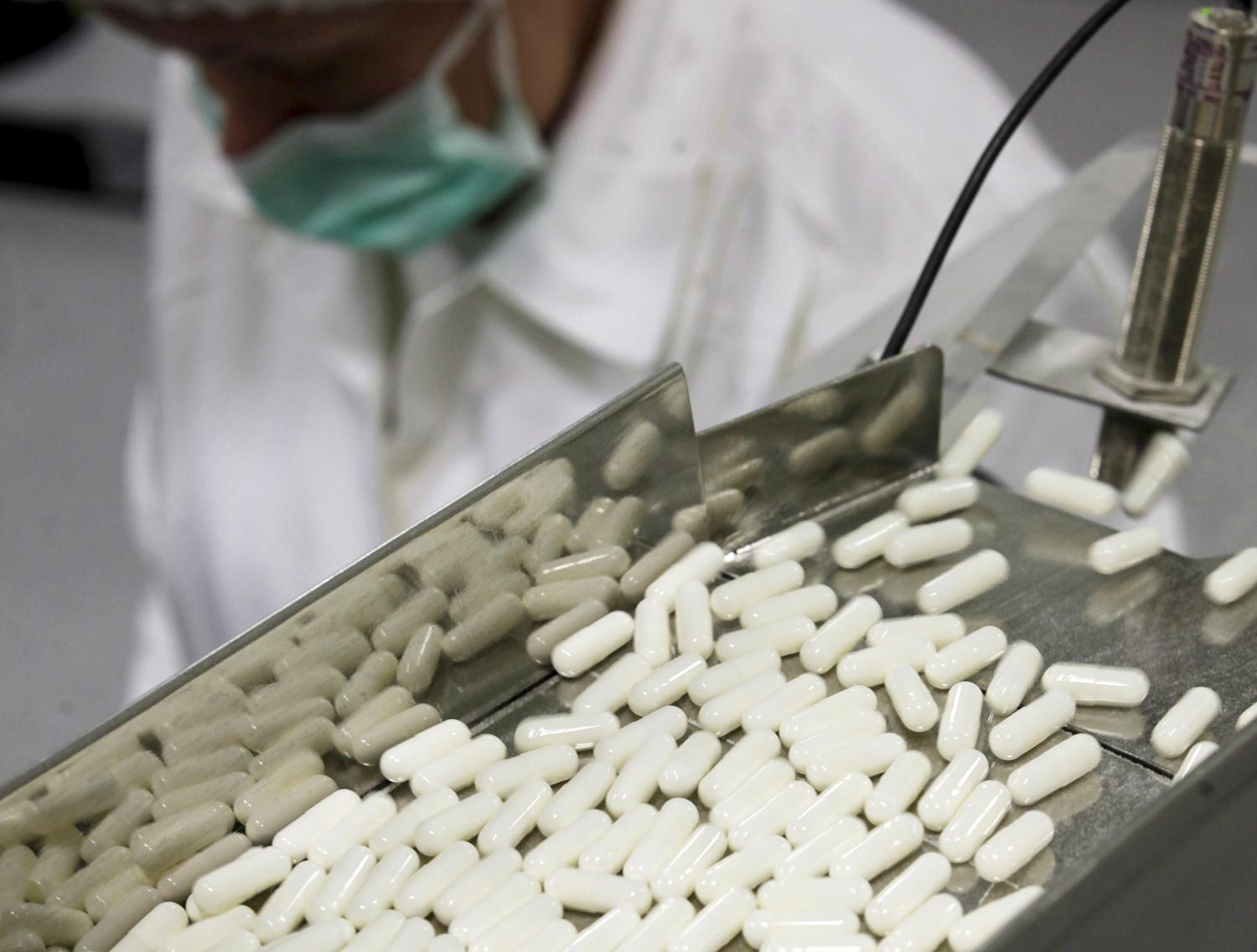 A manufacturing operator works at the Mildronate (Meldonium) medication packaging process in the production plant of the Grindeks pharmaceutical company in Riga