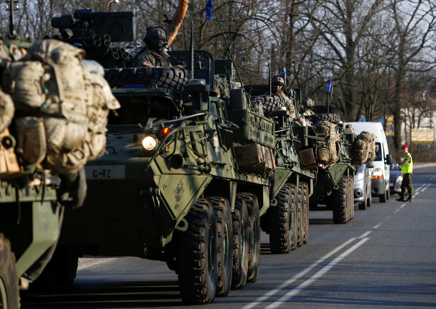 A convoy of U.S. troops, a part of NATO's reinforcement of its eastern flank, who are on their way from Germany to Orzysz in northeast Poland, drive through Sulejowek towards a military base in Wesola