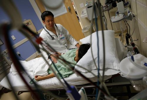 Patient Navarro speaks with Doctor Yeh in the Emergency Room at OSF Saint Francis Medical Center in Peoria