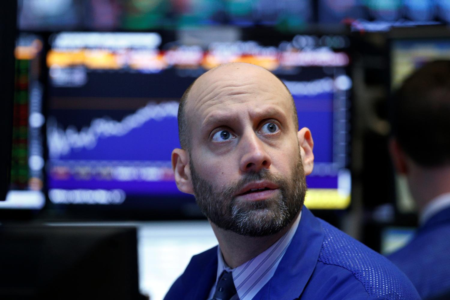 A trader works on the floor of the New York Stock Exchange in the Manhattan borough of New York