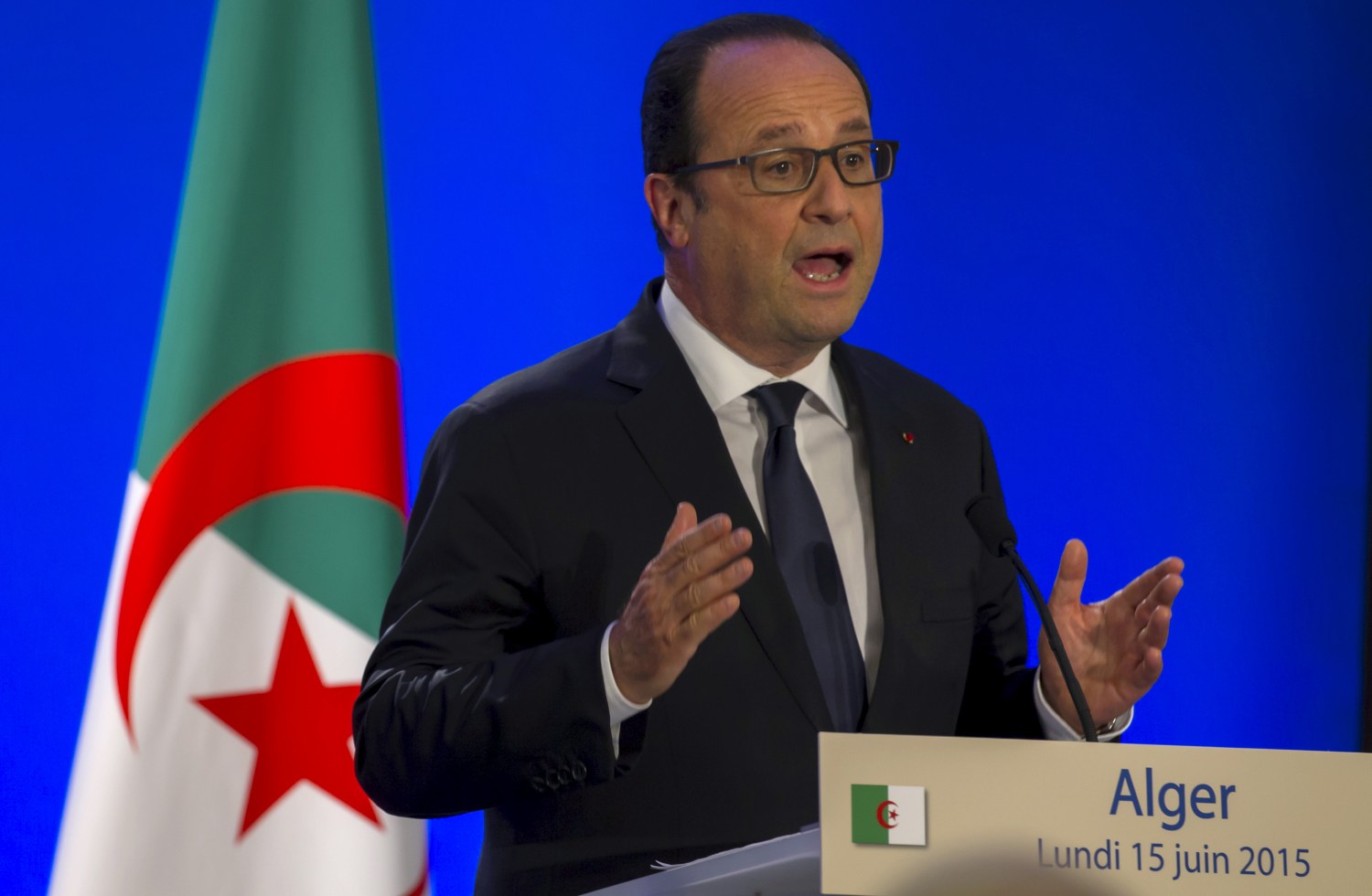 French President Hollande speaks during a news conference in Algiers