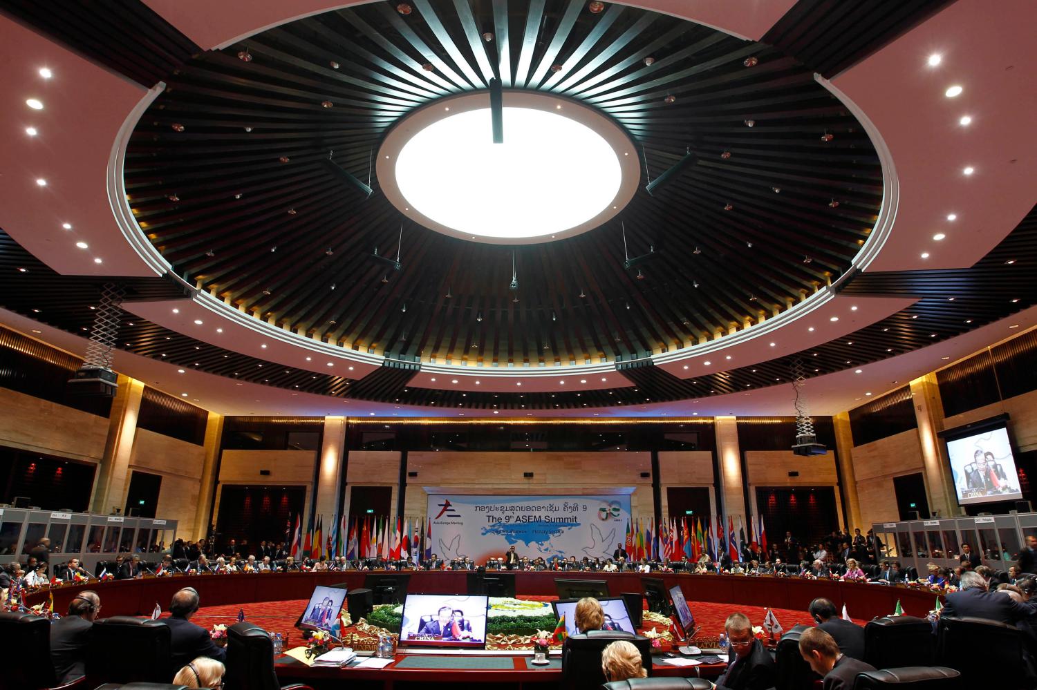 International leaders attend the plenary session of the ASEM Summit in Vientiane
