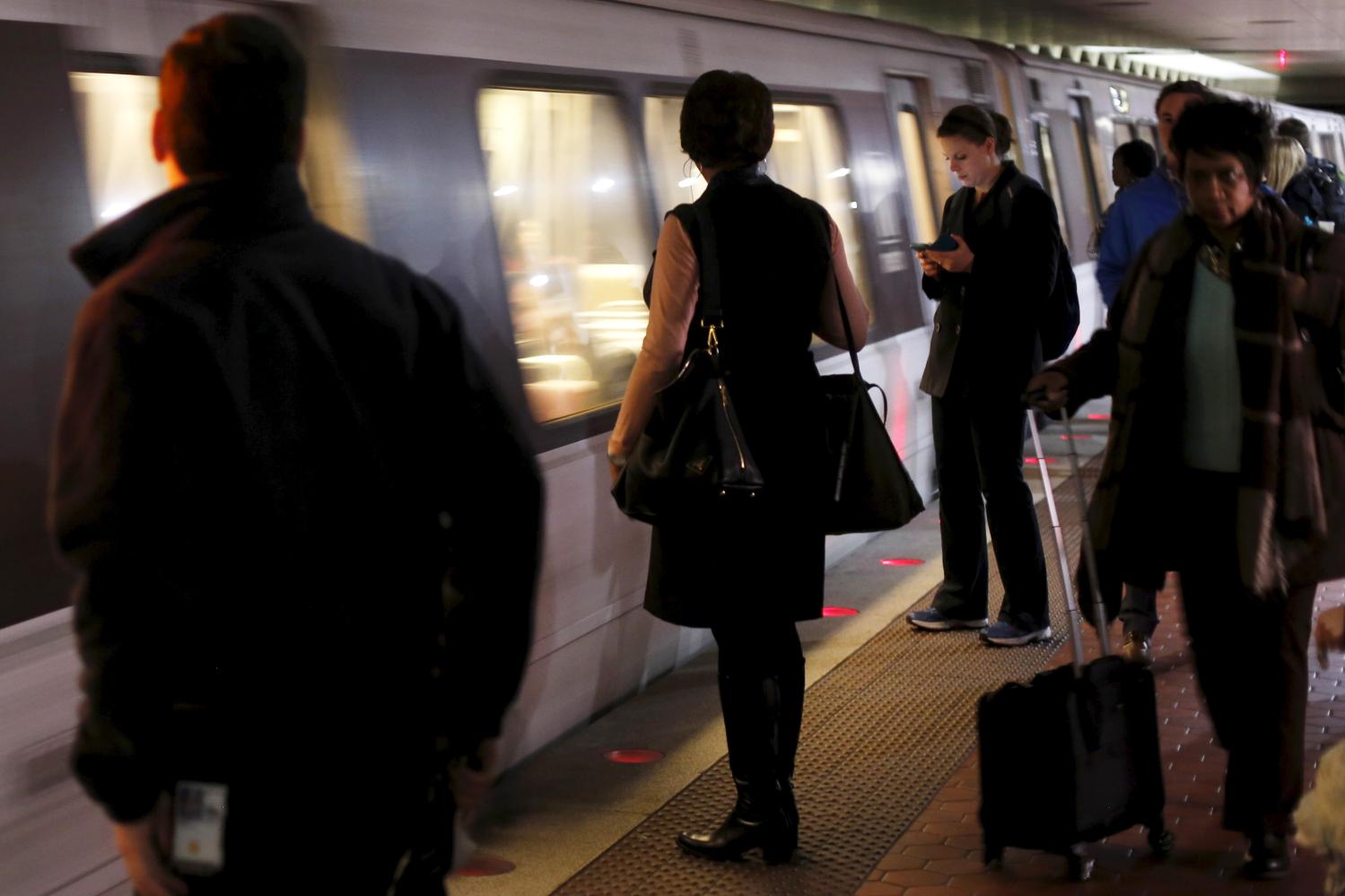 People ride the Metro subway system during the evening rush hour in Washington