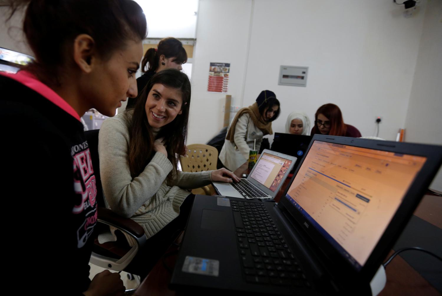 Syrian refugees and displaced Iraqis attend their class to learn basic and advanced coding skills at Re:Coded boot camp, in Erbil