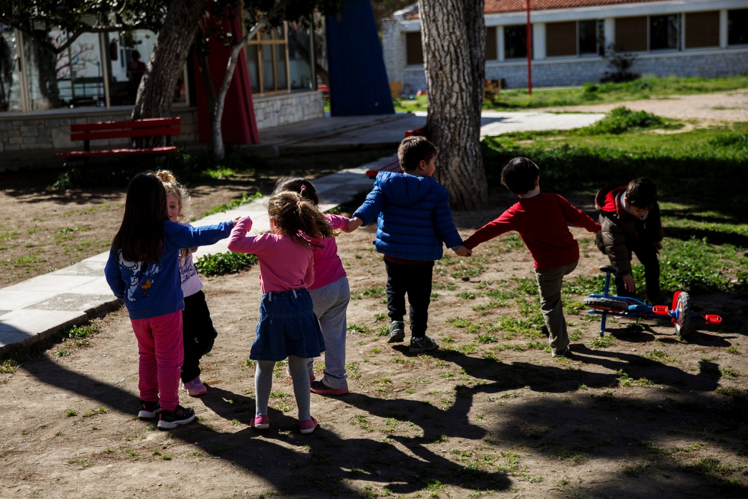 Children play in the yard of the Model National Nursery of Kallithea, in Athens