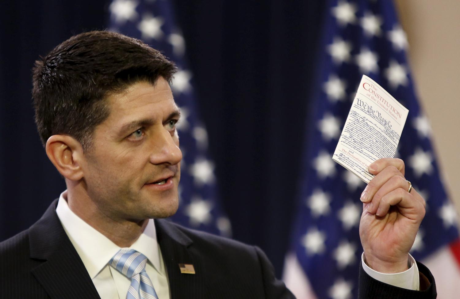 US Speaker of the House Ryan displays US Constitution while delivering speech on "the state of American politics" to interns on Capitol Hill in Washington