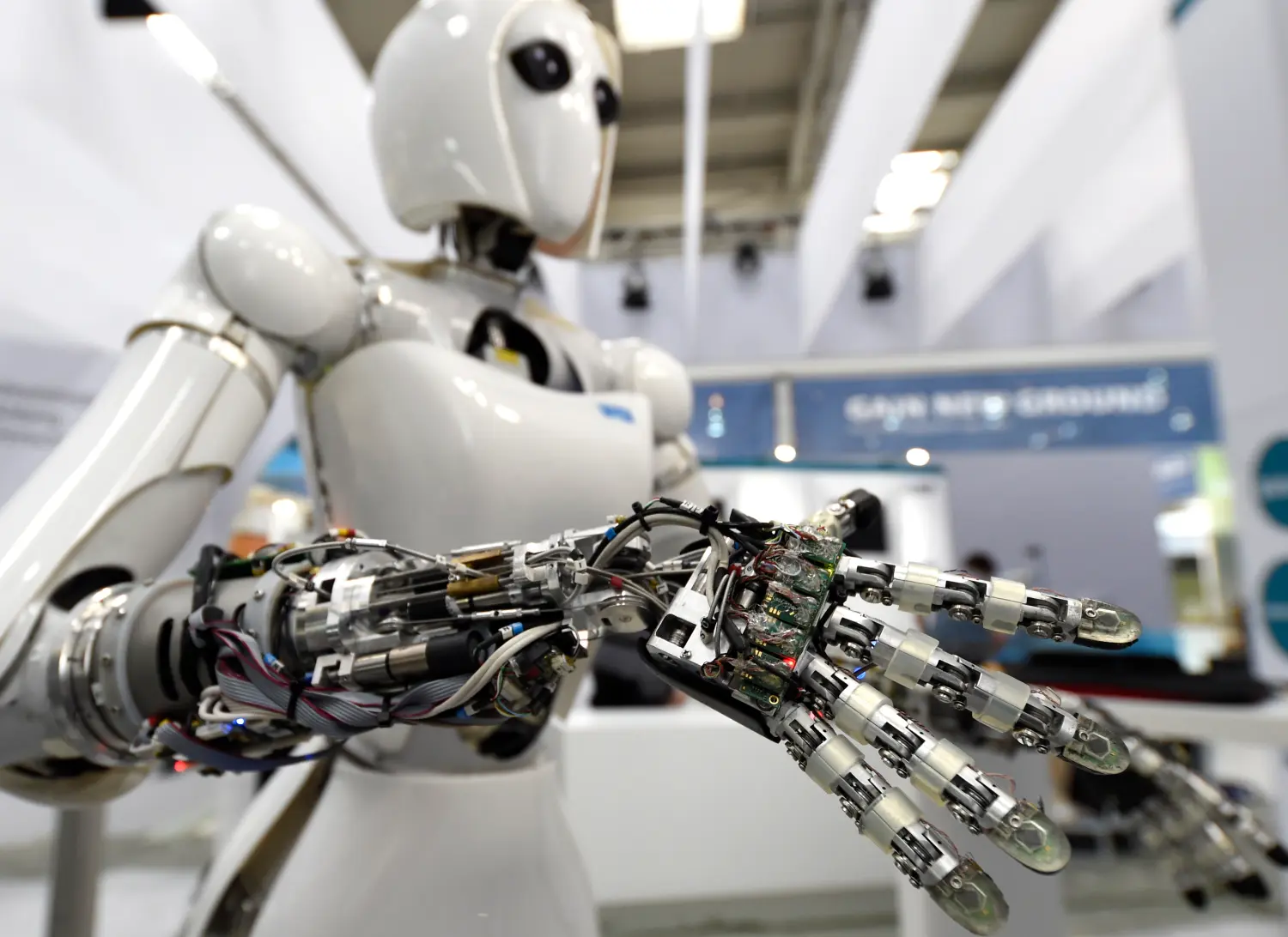 A robot is displayed at the Robotics Innovation Center booth during preparations at the CeBit computer fair in Hanover