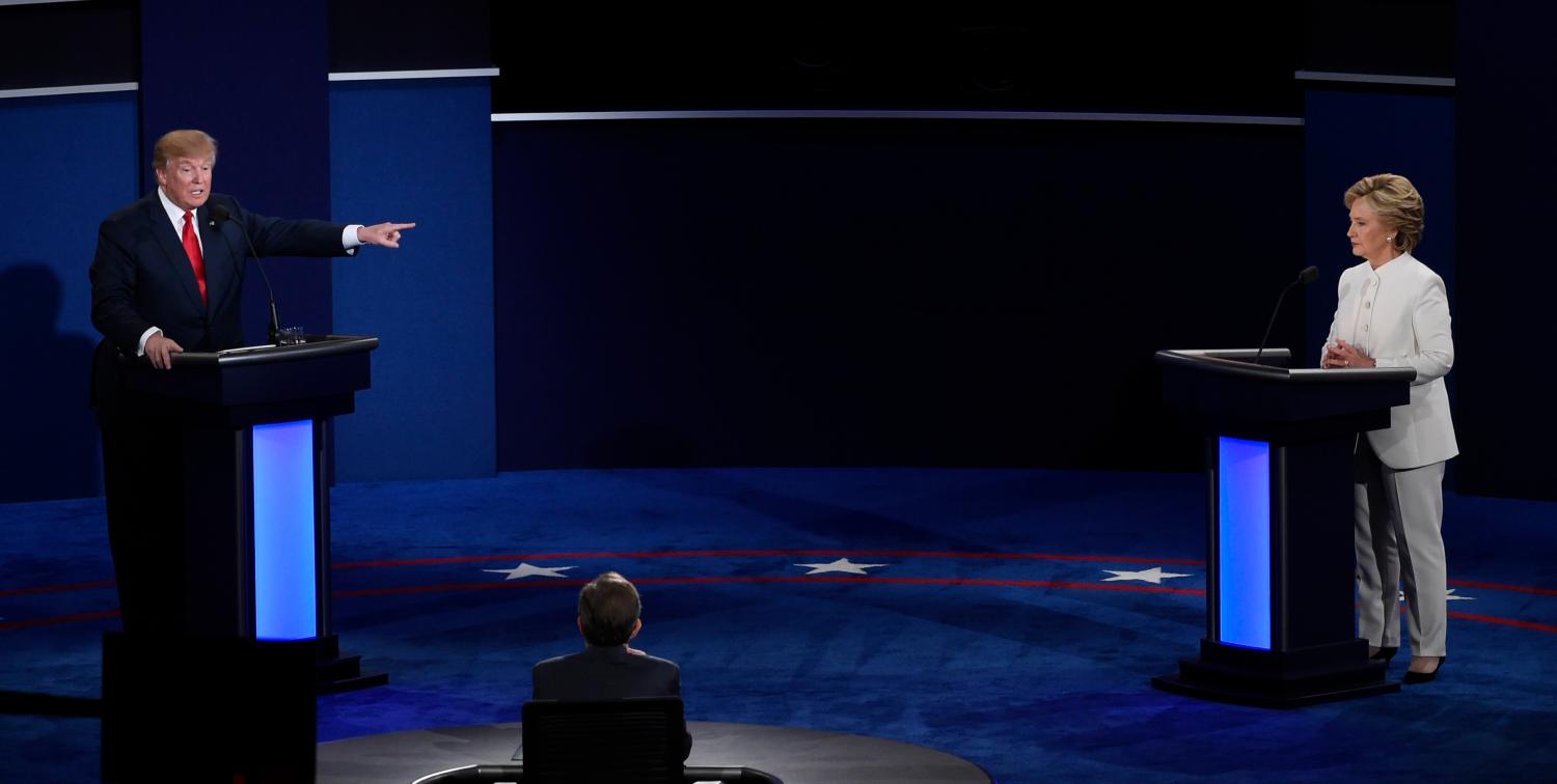 Republican U.S. presidential nominee Donald Trump speaks as Democratic U.S. presidential nominee Hillary Clinton listens during their third and final 2016 presidential campaign debate at UNLV in Las Vegas