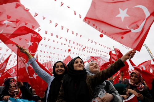 Supporters of Turkish President Erdogan wave national flags during a rally for the upcoming referendum in the Black Sea city of Rize