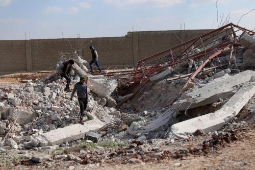 Youth inspect rubble of a damaged house after an airstrike yesterday on rebel-held Daraa Al-Balad, Syria April 7, 2017. REUTERS/Alaa Al-Faqir - RTX34ML0