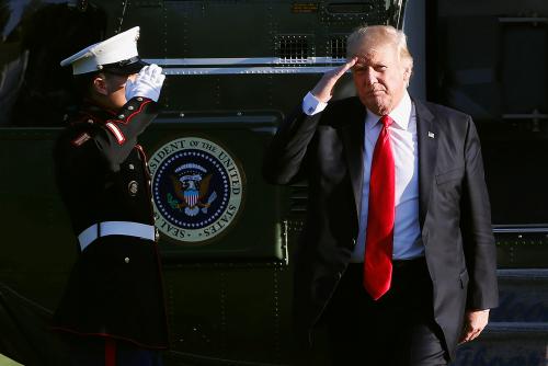 President Donald Trump saluting a Marine