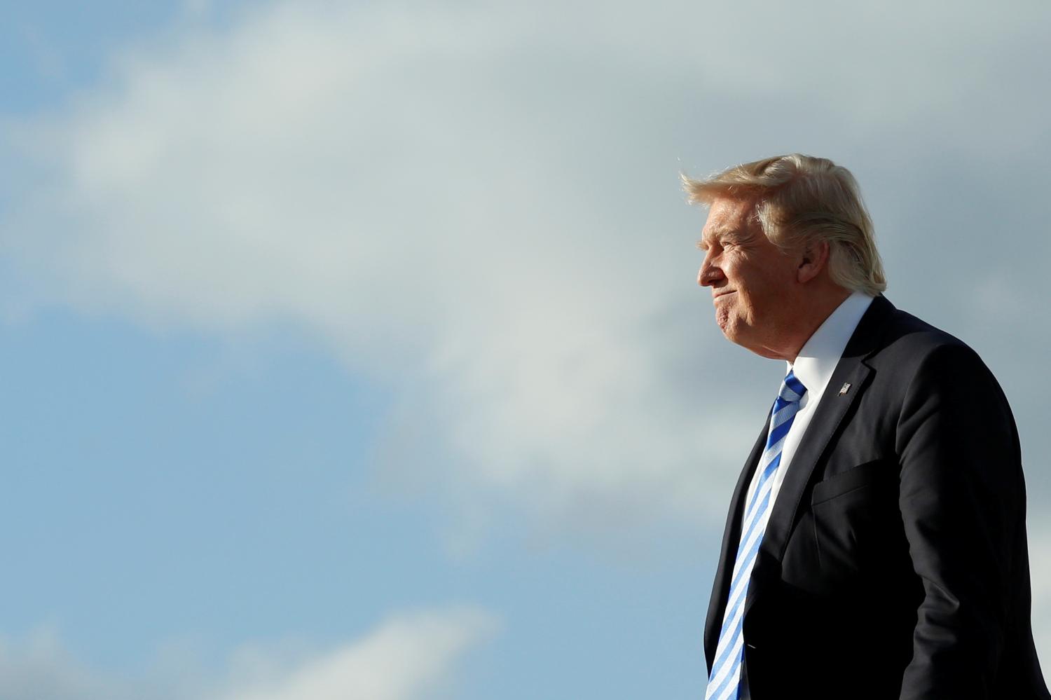 U.S. President Donald Trump arrives at Palm Beach International Airport in West Palm Beach, Florida, for the Good Friday holiday and Easter weekend, April 13, 2017. REUTERS/Yuri Gripas - RTX35HM2