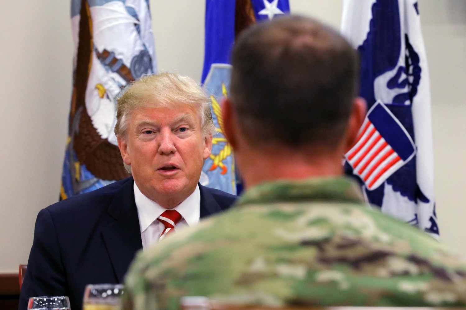 U.S. President Donald Trump attends a lunch with members of the U.S. military during a visit at the U.S. Central Command (CENTCOM) and Special Operations Command (SOCOM) headquarters in Tampa, Florida, U.S., February 6, 2017. REUTERS/Carlos Barria - RTX2ZW4Z