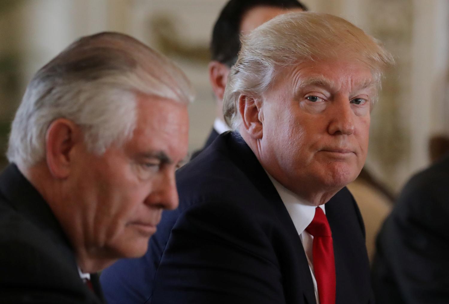 U.S. President Donald Trump (R) sits next to Secretary of State Rex Tillerson during a bilateral meeting with China's President Xi Jinping (Not Pictured) at Trump's Mar-a-Lago estate in Palm Beach, Florida, U.S., April 7, 2017. - RTX34MB6