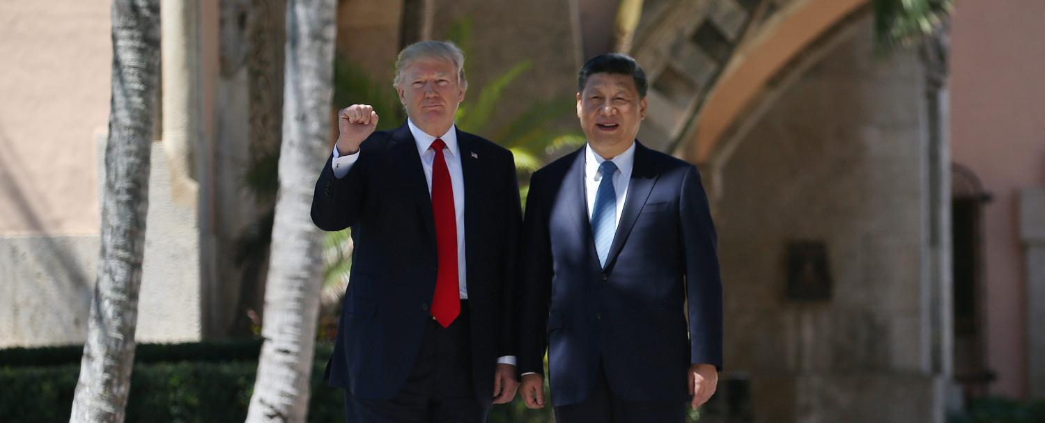 U.S. President Donald Trump and China's President Xi Jinping are seen during a walk along the front patio of the Mar-a-Lago estate after a bilateral meeting in Palm Beach, Florida, U.S., April 7, 2017. REUTERS/Carlos Barria - RTX34MDB