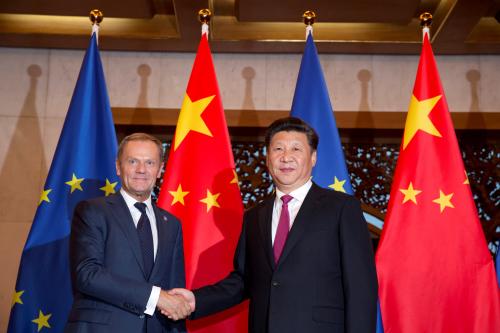 European Council President Donald Tusk, left and Chinese President Xi Jinping shake hands before a meeting held at the Diaoyutai State Guesthouse in Beijing, China, Tuesday, July 12, 2016. REUTERS/Ng Han Guan/Pool - RTSHIVN