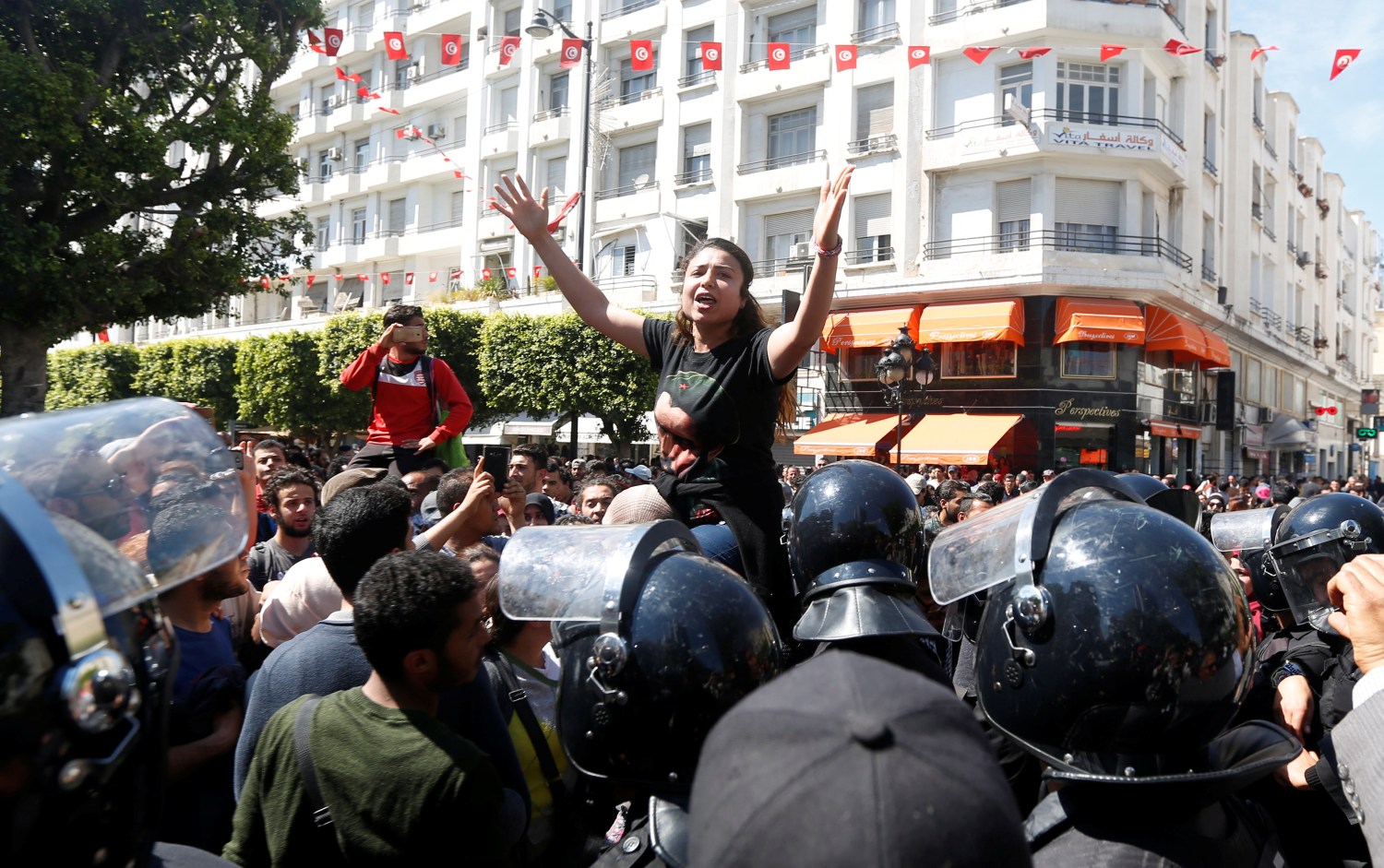 Law students shout slogans during a demonstration against the government in Tunis, Tunisia