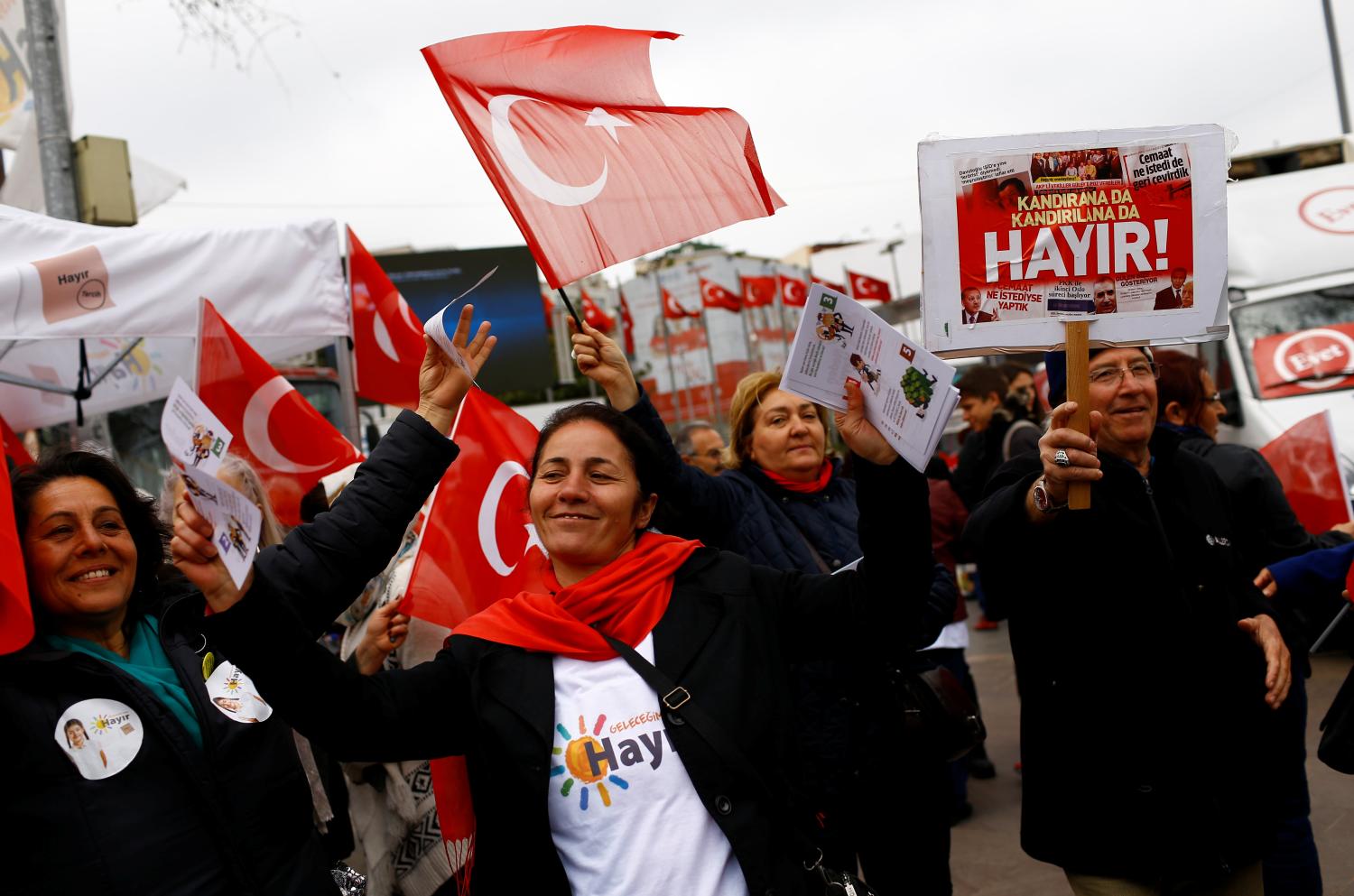 "Hayir", "No" in English, supporters hold Turkish flags and leaflets for the upcoming referendum at a campaign point in Istanbul, Turkey, March 31, 2017. Picture taken March 31, 2017. REUTERS/Murad Sezer - RTX354XR