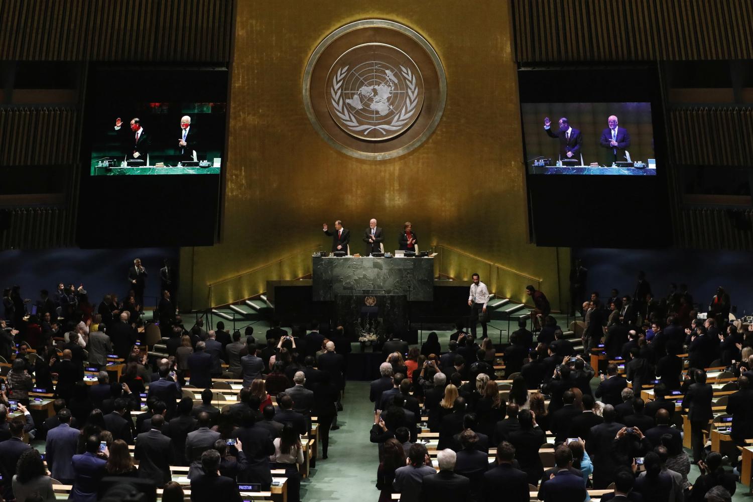 United Nations Secretary-General Ban Ki-moon waves to the assembly after speaking during the swearing-in of Secretary-General-designate Mr. Antonio Guterres at UN headquarters in New York, U.S., December 12, 2016. REUTERS/Lucas Jackson - RTX2UPJG