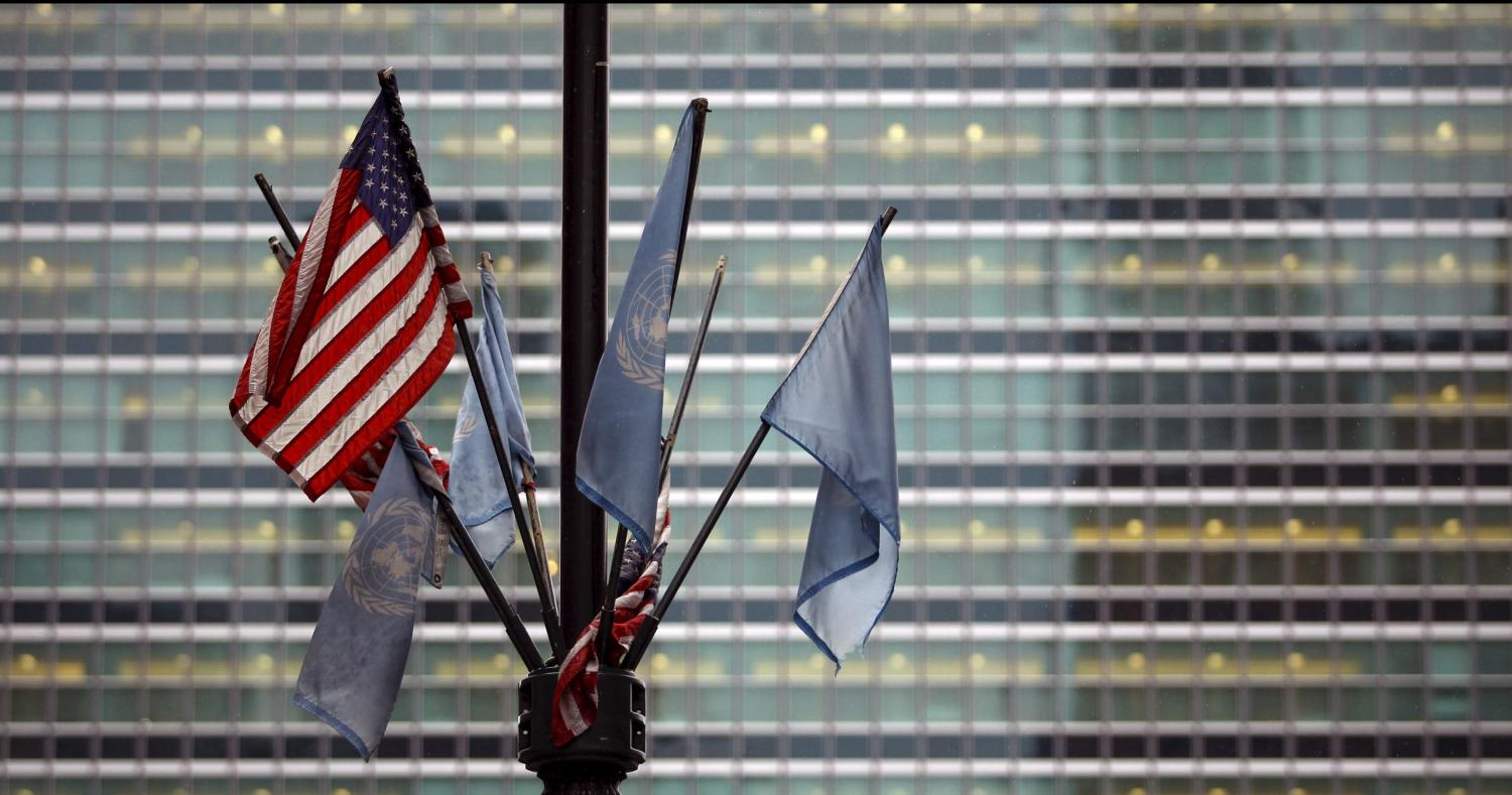 U.N. flags and the U.S. flag are seen in front of the United Nations headquarters where the Permanent Memorial to Honour the Victims of Slavery and the Transatlantic Slave Trade "The Ark of Return" is to be unveiled in New York, March 25, 2015. REUTERS/Eduardo Munoz - RTR4UVP7