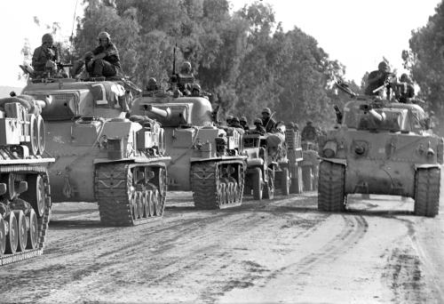 A convoy of Israeli tanks rolls towards the front during the 1967 Middle East War, widely known as the Six Day War, in this picture released on June 4, 2007 by Israel's Defence Ministry. Forty years ago this week, Israel swept to victory in six days in a war with Egypt, Syria and Jordan, capturing the Sinai peninsula, Golan Heights, Gaza Strip and West Bank, including Arab East Jerusalem. REUTERS/Israeli Defence Ministry/Handout BLACK AND WHITE ONLY. EDITORIAL USE ONLY. NOT FOR SALE FOR MARKETING OR ADVERTISING CAMPAIGNS. - RTR1QFM3