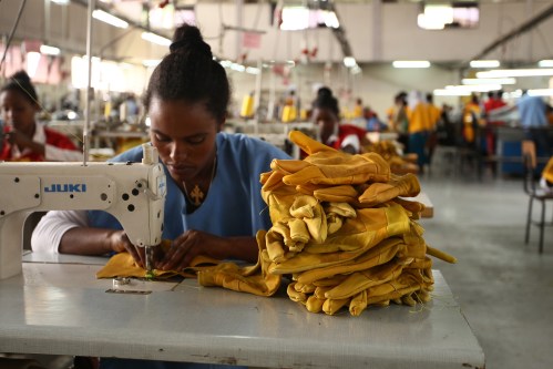 A woman stitches leather gloves at the Pittards world class leather manufacturing company in Ethiopia's capital Addis Ababa