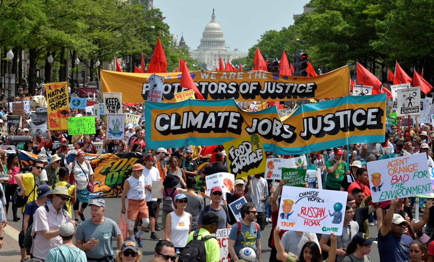 Demonstrators march down Pennsylvania Avenue during a People's Climate March