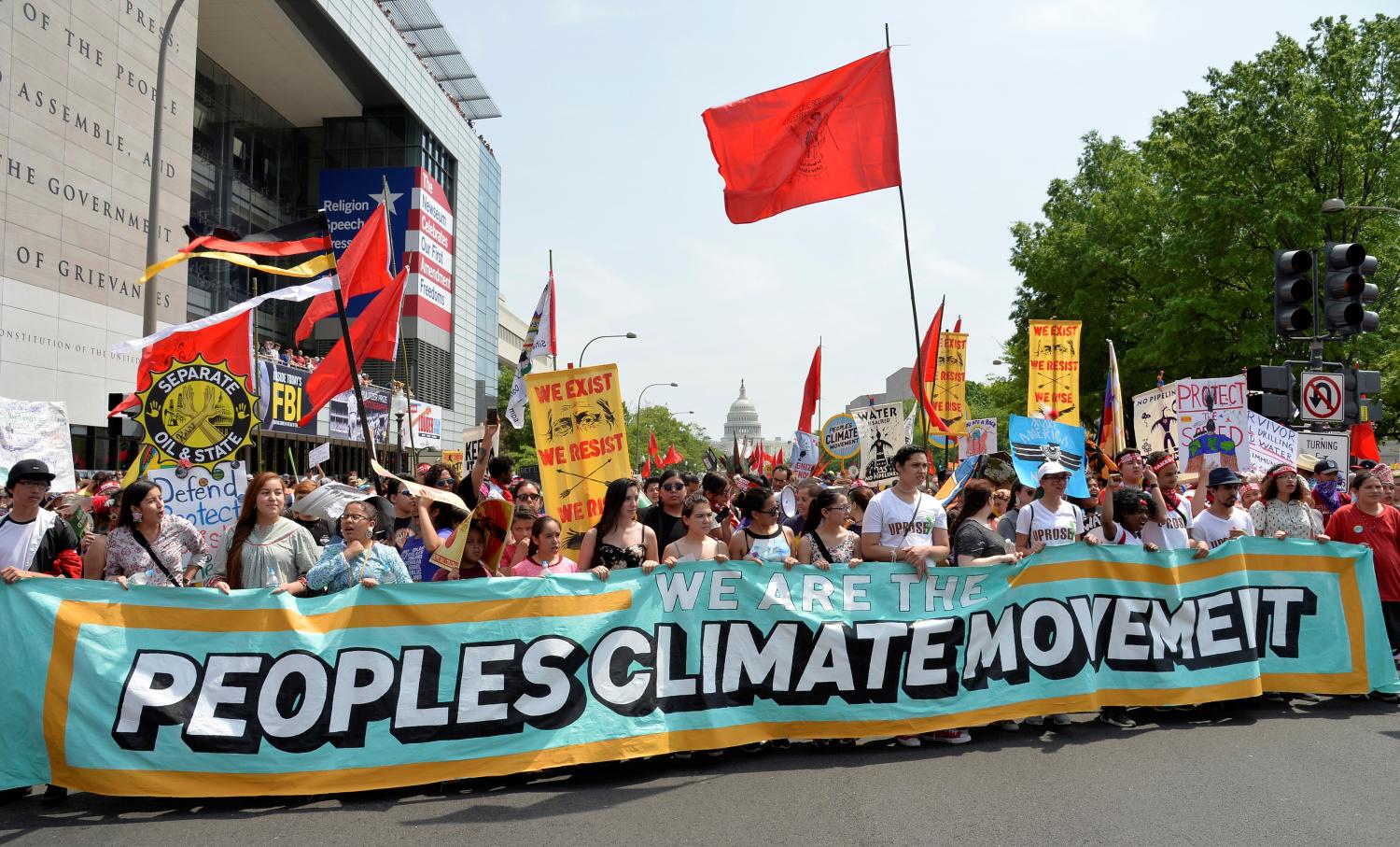 Demonstrators march down Pennsylvania Avenue during a People's Climate March, to protest U.S. President Donald Trump stance on the environment, in Washington