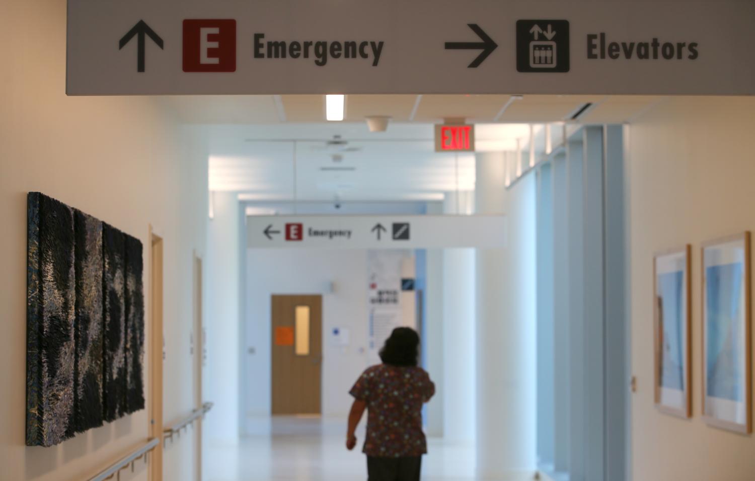 An emergency sign directs patients and staff to the emergency room.