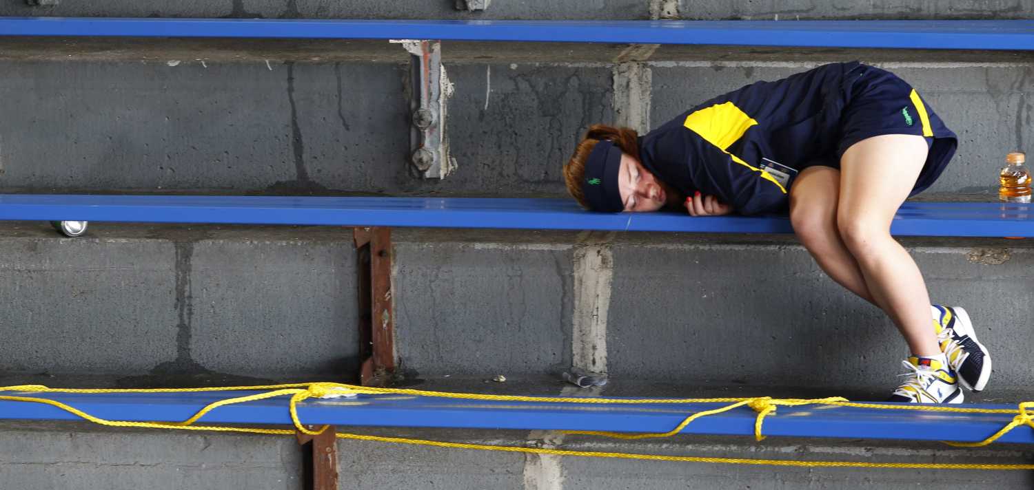 A girl naps in the stands at the U.S. Open tennis tournament in New York