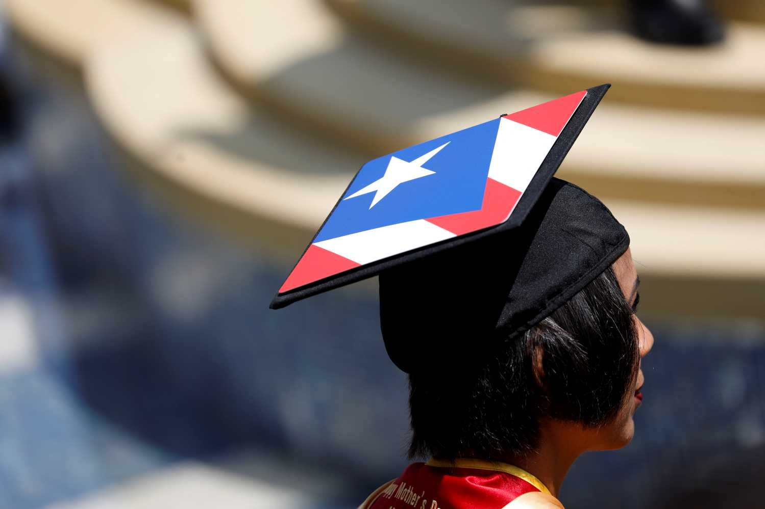 A graduate wears a decorated mortarboard cap after their commencement ceremony at the University of Southern California (USC) in Los Angeles, California