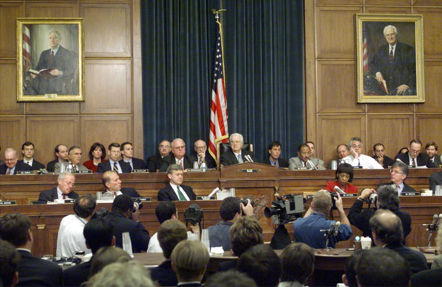 Members of the House Judiciary Committe hold their first hearing where they began a debate October 5 over whether to hold hearings into the scandal surrounding President Clinton and begin only the third presidential impeachment inquiry in U.S. history. The portrait on the wall at left is of former Rep. Peter Rodino (D-NJ) who was the Chairman of the House Judiciary Committee that investigated President Nixon's Watergate scandal. The portrait at right is of current chairman Rep. Henry Hyde, (R/IL. GMH/ME - RTRU7C9
