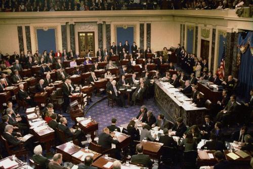 Senate Minority Leader Tom Daschle (D-SD) (center,L) stands to address the Senate during the proceedings to vote on the two impeachment charges against President Clinton February 12. The Senate rejected both counts, with neither charge getting a majority of votes. The House Managers are seen seated around a table at the center. RC/SV - RTRLUD2