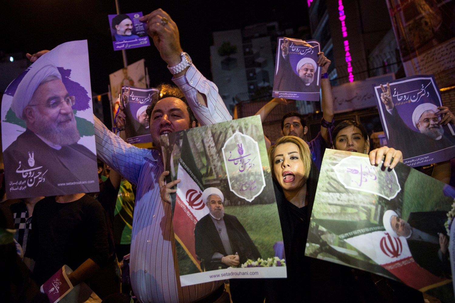 Supporters of Iran's President Hassan Rouhani hold his posters during a campaign rally in Tehran, Iran, May 17, 2017. Picture taken May 17, 2017. TIMA via Reuters ATTENTION EDITORS - THIS IMAGE WAS PROVIDED BY A THIRD PARTY. FOR EDITORIAL USE ONLY.