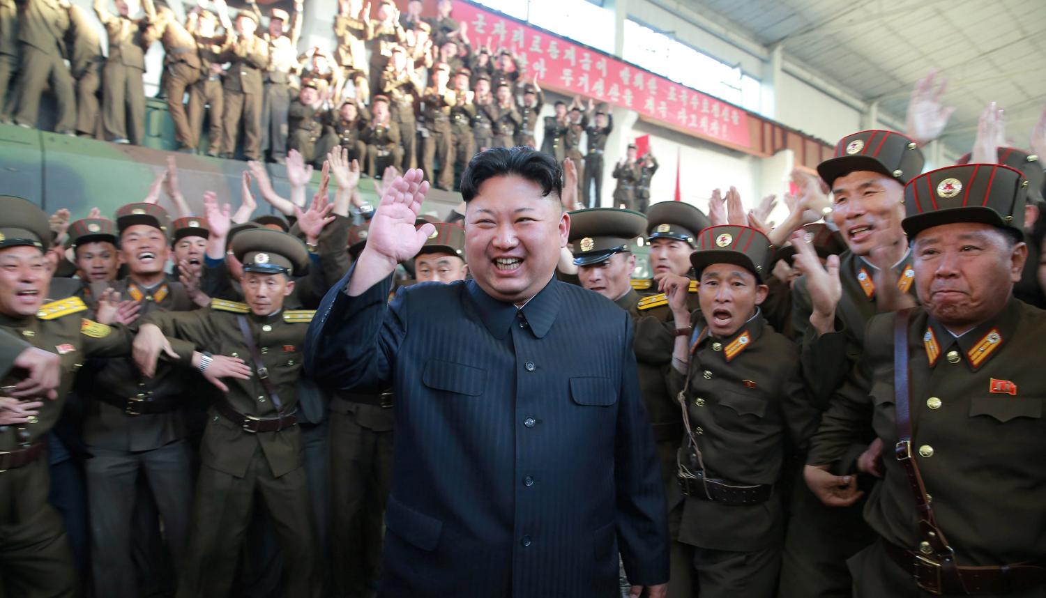 North Korean leader Kim Jong Un reacts with members of the Korean People's Army in this undated photo released by North Korea's Korean Central News Agency (KCNA) on May 15, 2017. KCNA via REUTERS REUTERS ATTENTION EDITORS - THIS IMAGE WAS PROVIDED BY A THIRD PARTY. EDITORIAL USE ONLY. REUTERS IS UNABLE TO INDEPENDENTLY VERIFY THIS IMAGE. NO THIRD PARTY SALES. SOUTH KOREA OUT. - RTX35VOI