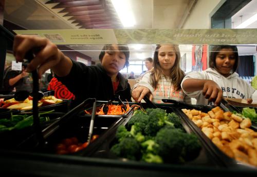 Students get their lunch from a salad bar at the school cafeteria as some of more than 8,000lbs of locally grown broccoli from a partnership between Farm to School and Healthy School Meals is served at Marston Middle School in San Diego
