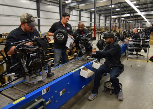 Workers construct mini-bikes at motorcycle and go-kart maker Monster Moto in Ruston